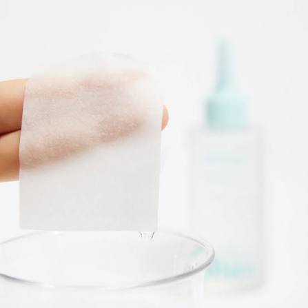 Cotton pad soaked with ilso Super Melting Sebum Softener